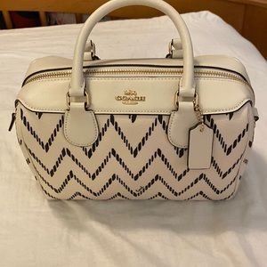 Cream and black chevron purse. Never used. Nonsmoking, pet free home.